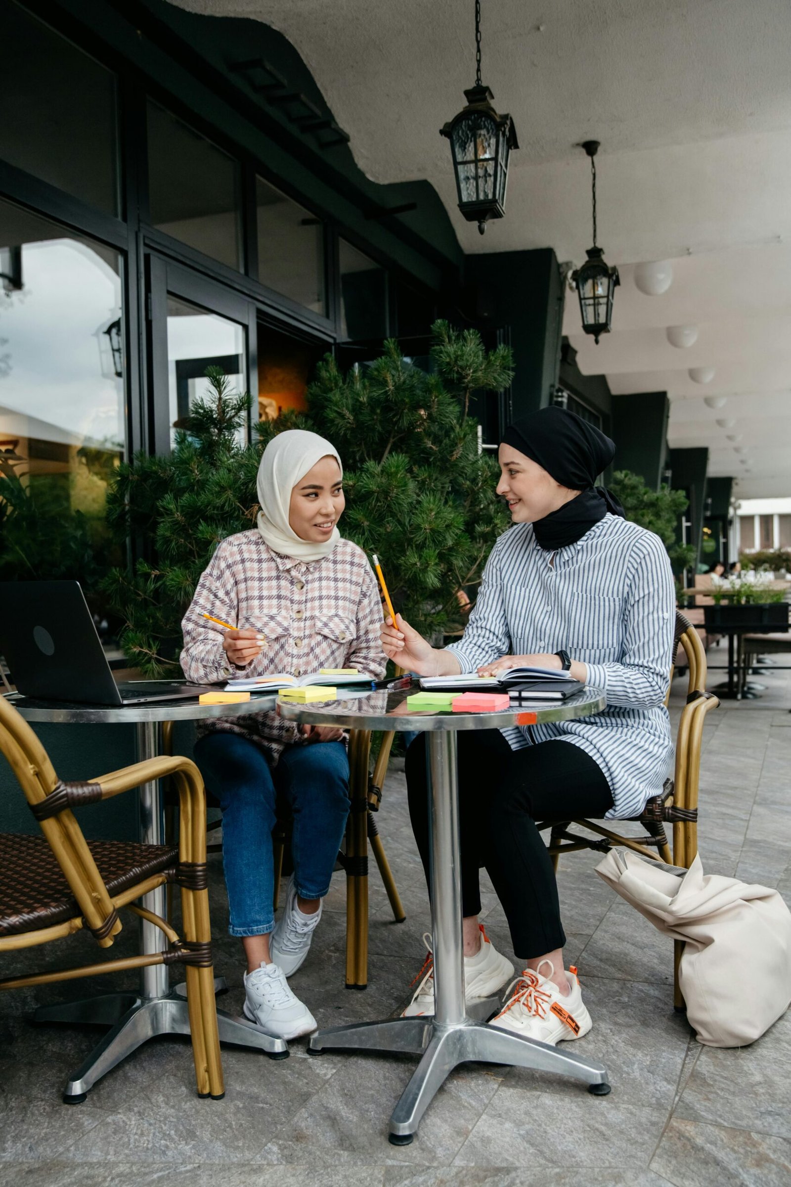 Two people studying together and discussing their goals