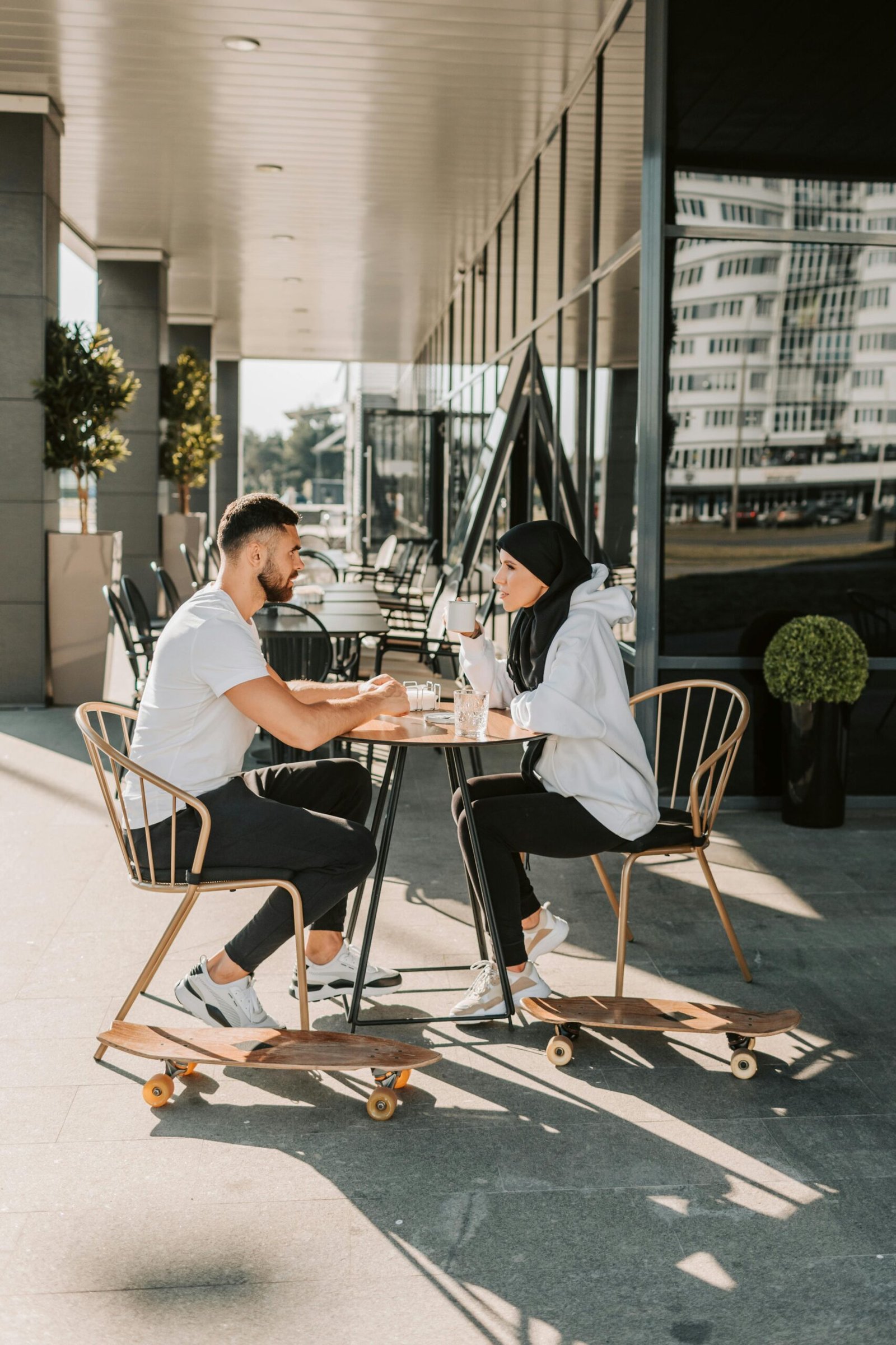 Couple having a supportive conversation over coffee.